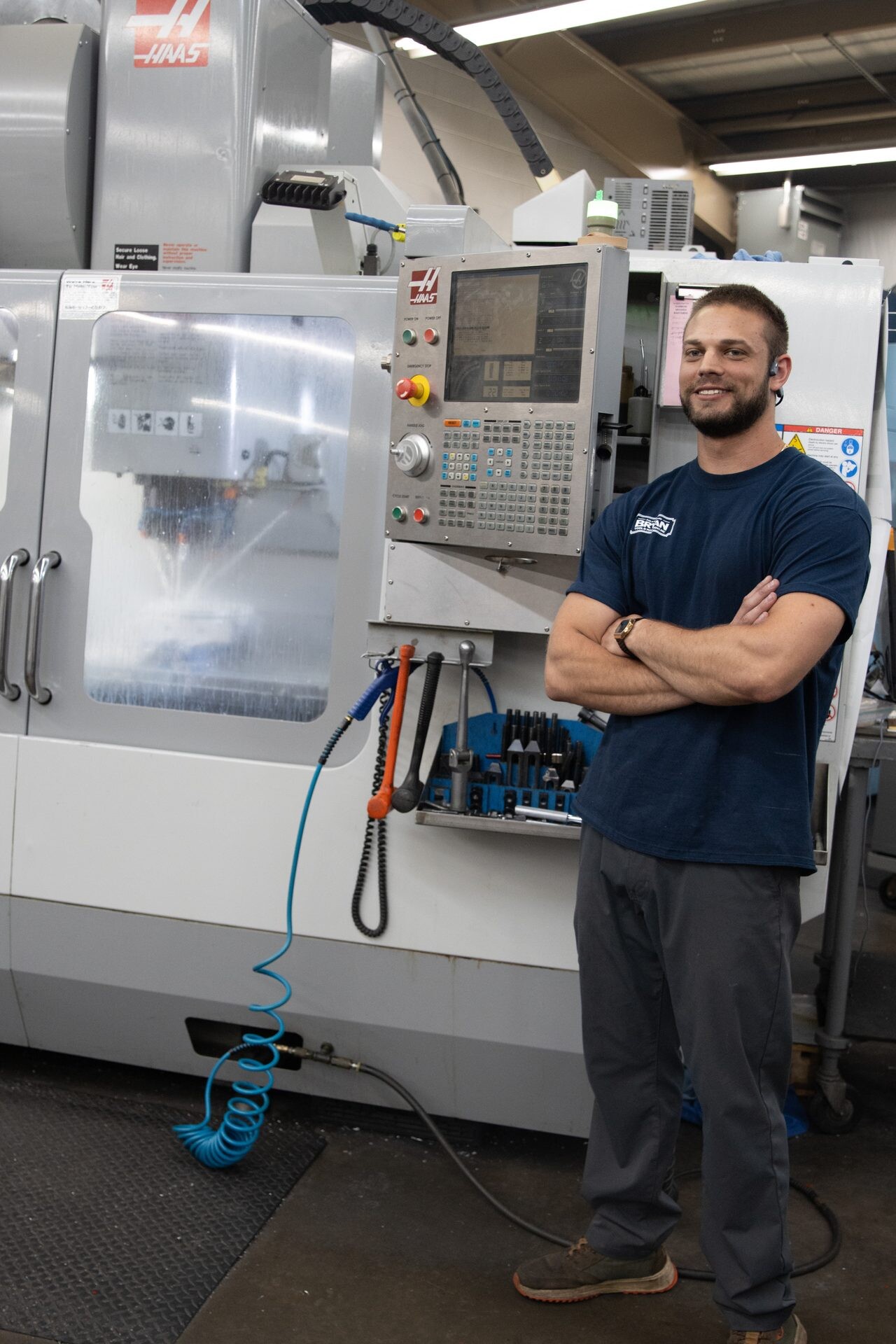 A Bryan Tool machinist at his Haas CNC machining center